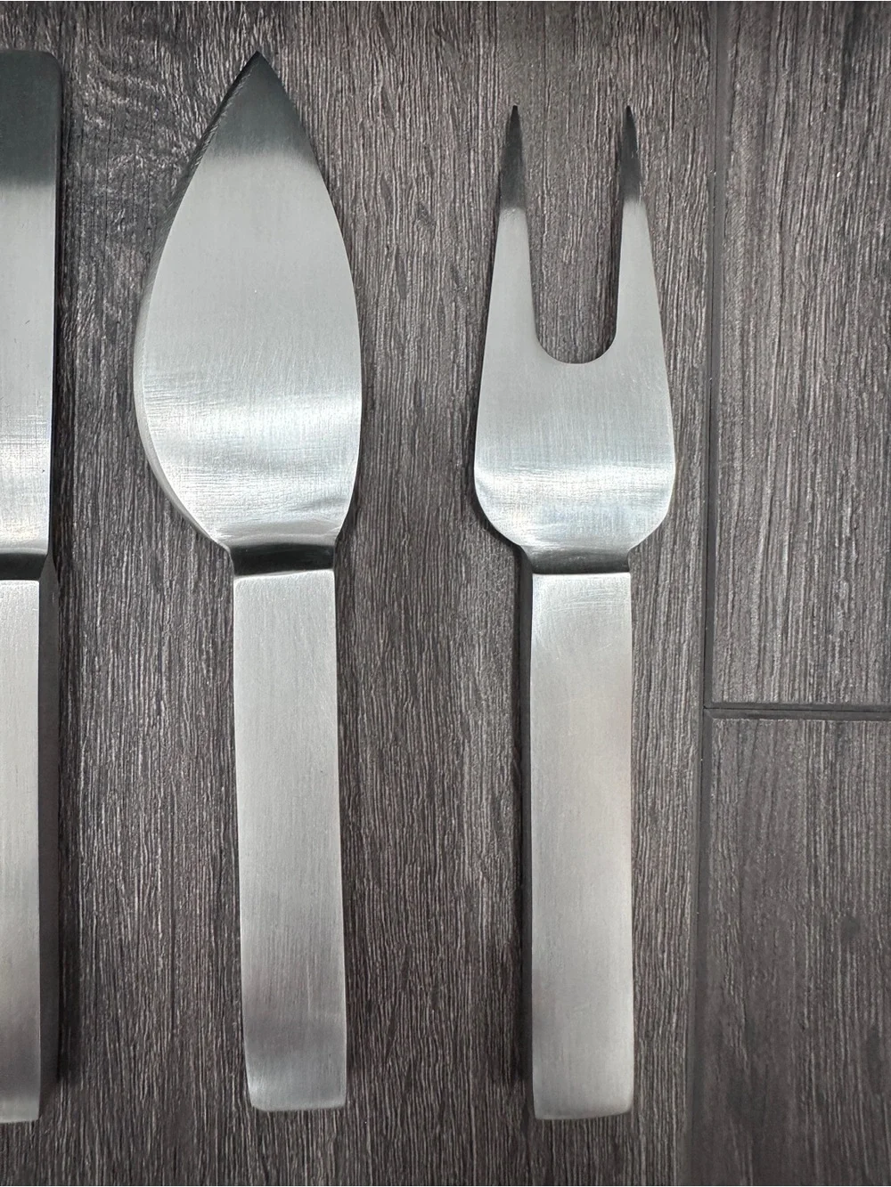 Calvin Klein stainless steel cheese serving set by Calvin Klein Home collection.